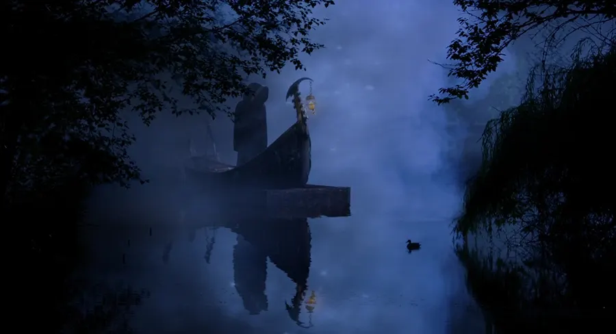 A dark river scene featuring a boat shrouded in mist and shadows, with a figure standing at the bow.