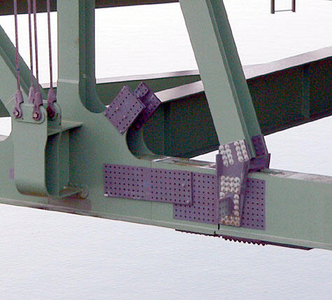 Bridge Structural Support Detail Close-up of a bridge structural support showcasing connection plates and bolts, highlighting engineering and construction details.