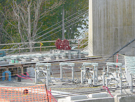 Construction Site Equipment Overview Overview of construction site equipment including reels, supports, and cables for building projects, showcasing essential tools for construction.