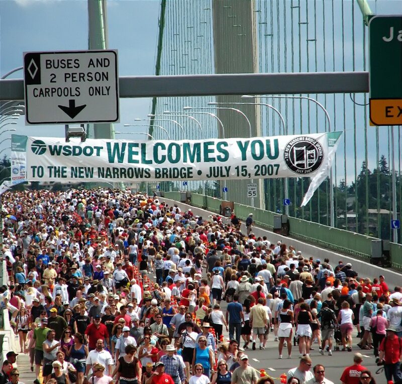 Crowd gathered at Narrows Bridge with WSDOT welcome banner on July 15, 2007, celebrating the opening of the new bridge.