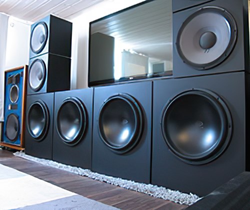 A setup of high-performance audio speakers featuring large subwoofers.